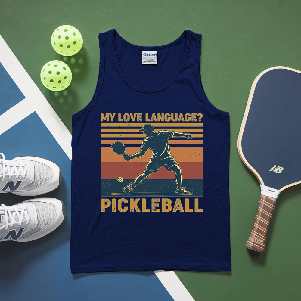 Blue tank top with pickleball design on a green and blue background with pickleballs and paddle.