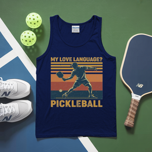Blue tank top with pickleball design on a green and blue background with pickleballs and paddle.