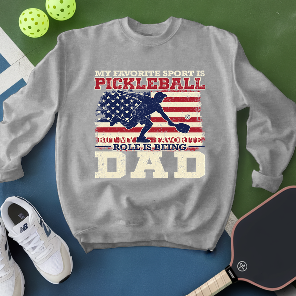 Gray sweatshirt with pickleball-themed design on a green and blue background