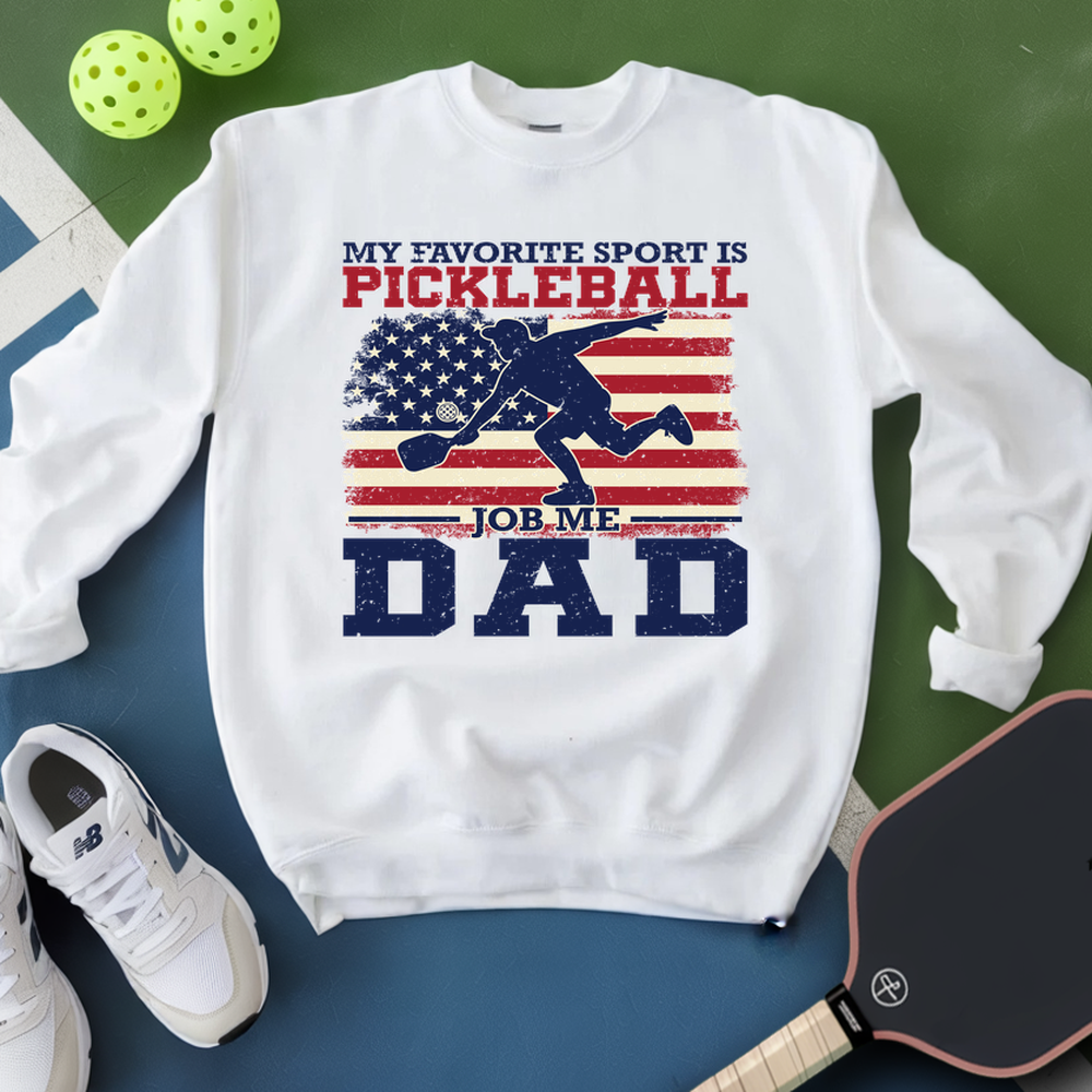 White sweatshirt with pickleball-themed design on a green and blue background
