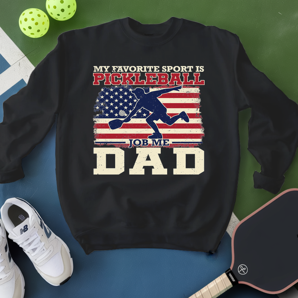 Black sweatshirt with pickleball-themed design on a blue and green background