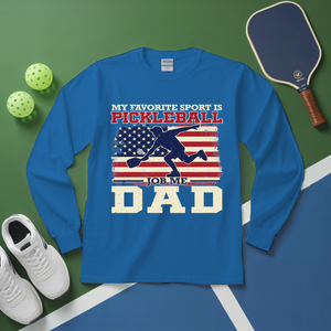 Blue long-sleeve shirt with pickleball design on a green and blue background