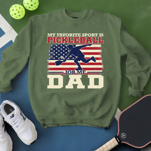 Green sweatshirt with pickleball-themed design on a green and blue background