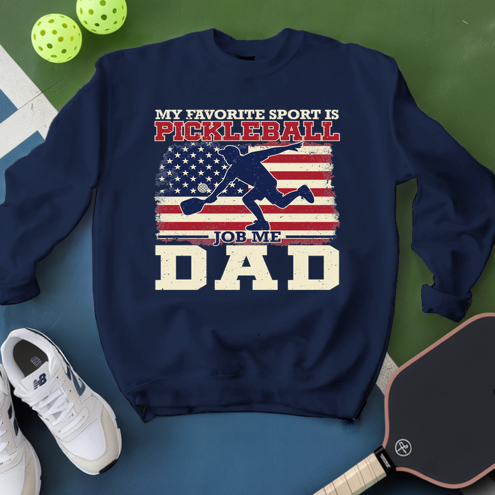 Navy sweatshirt with pickleball-themed design on a green and blue background