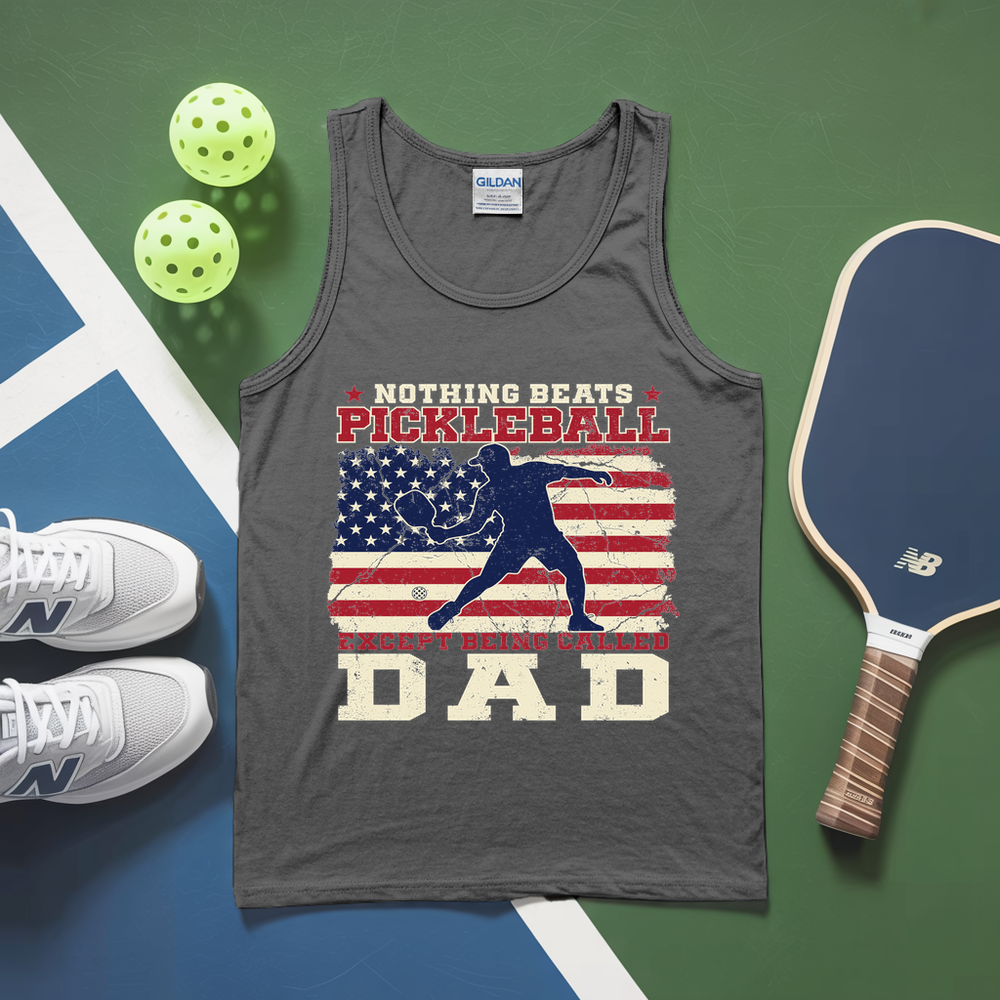 Gray tank top with pickleball design and accessories on a green and blue surface