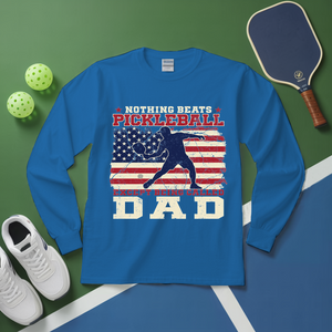 Blue long-sleeve shirt with pickleball design on a green and blue background