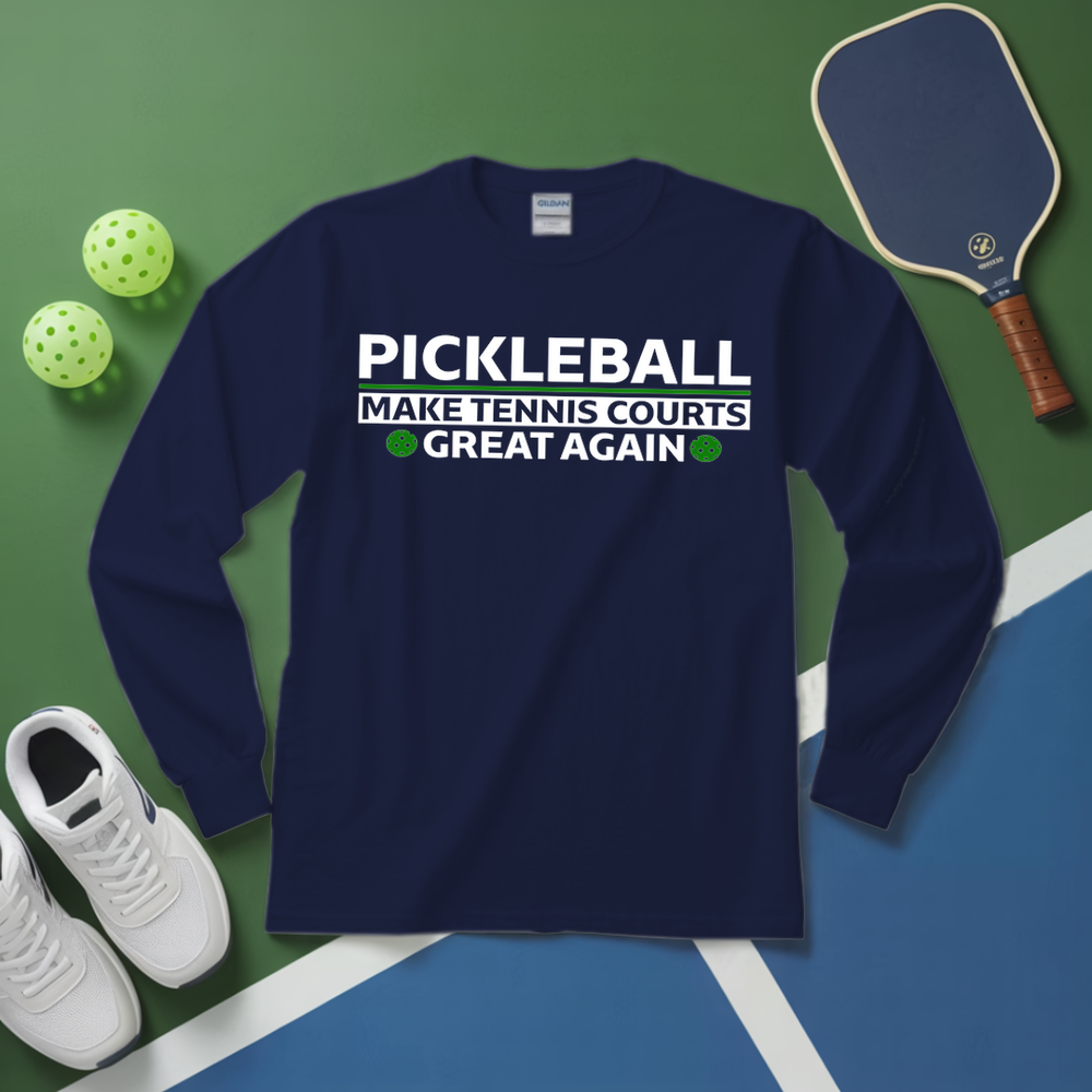 Navy blue sweatshirt with pickleball-themed text on a green and blue surface with pickleball equipment.