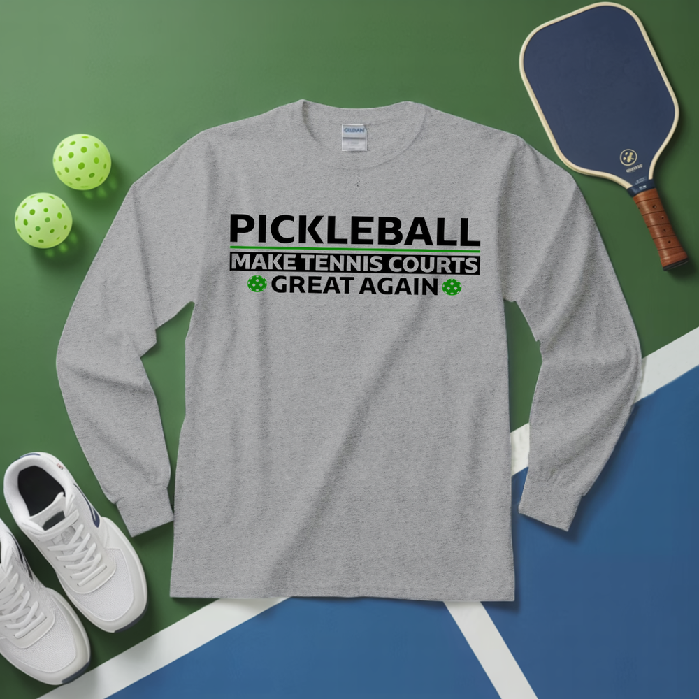 Gray long-sleeve shirt with pickleball text, pickleball paddle, and balls on a green and blue surface