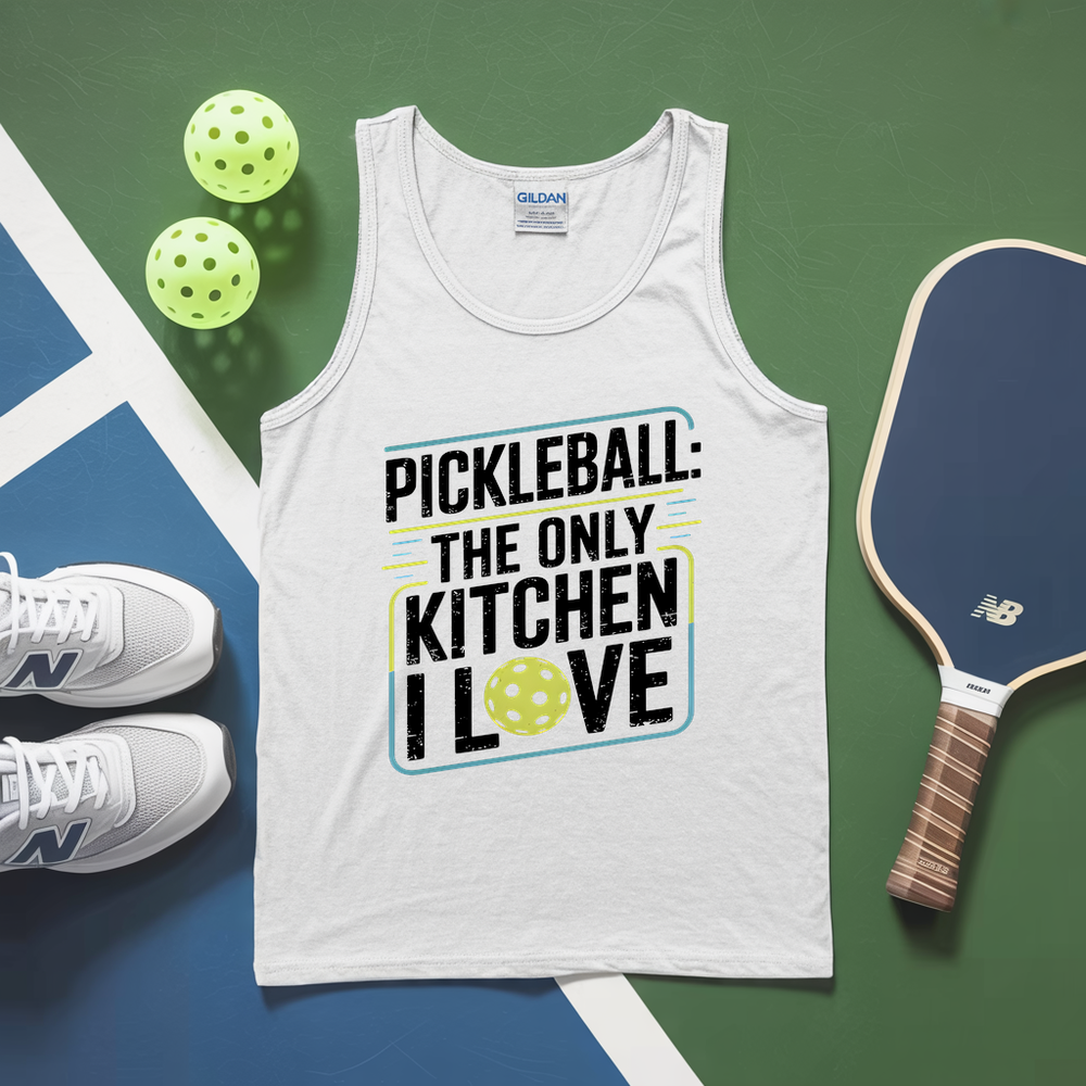 White tank top with pickleball-themed text, pickleballs, and paddle on a green and blue surface