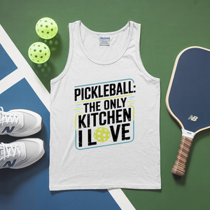 White tank top with pickleball-themed text, pickleballs, and paddle on a green and blue surface