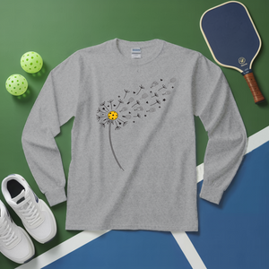 Gray long-sleeve shirt with dandelion design on a green and blue background with sports equipment.
