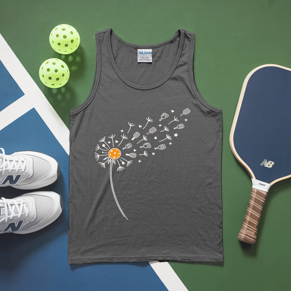 Gray tank top with dandelion design, pickleballs, and a paddle on a green and blue surface.