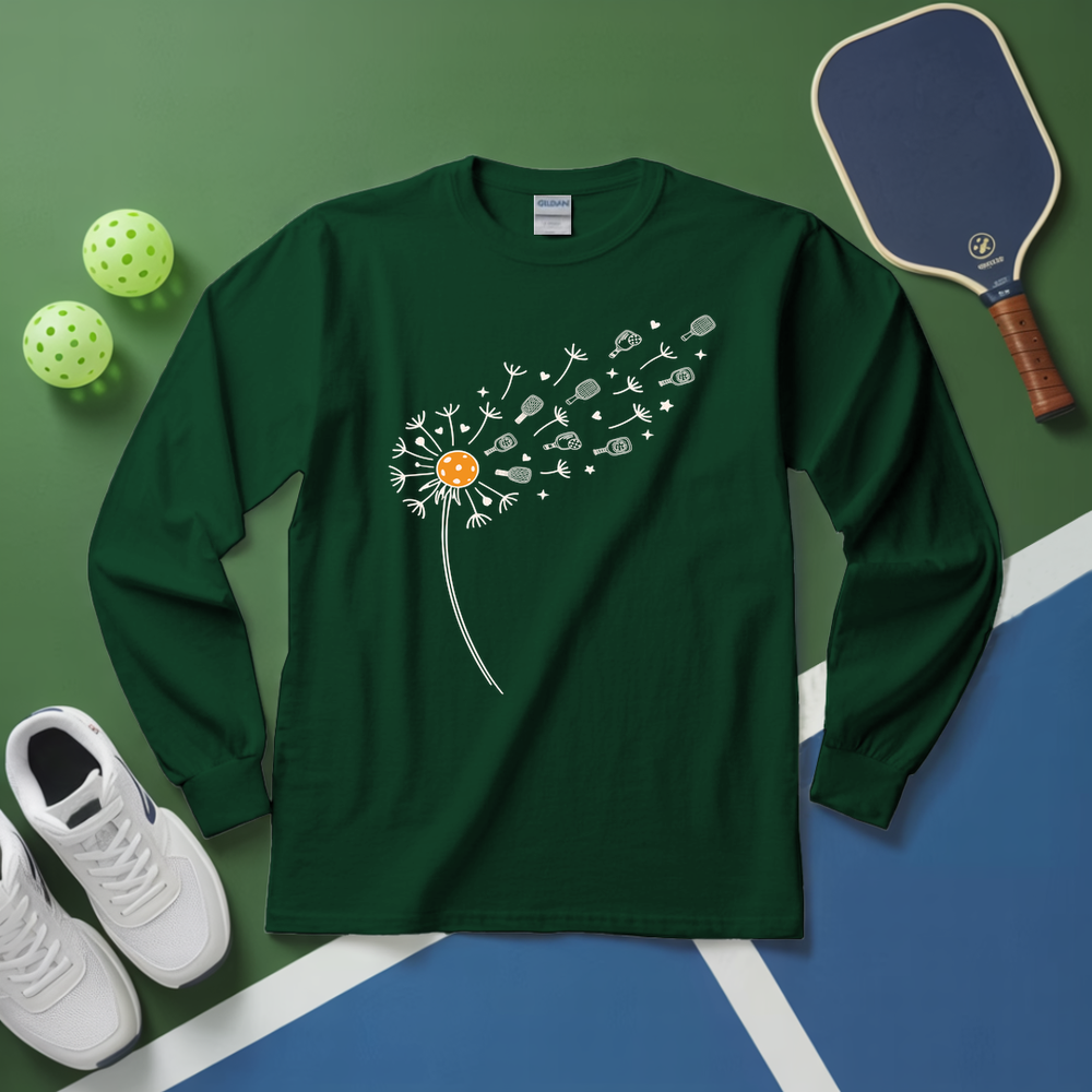 Green long-sleeve shirt with dandelion design on a green and blue surface with sports equipment.