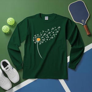 Green long-sleeve shirt with dandelion design on a green and blue surface with sports equipment.