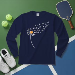 Navy blue long-sleeve shirt with dandelion design on a green and blue surface with sports equipment.
