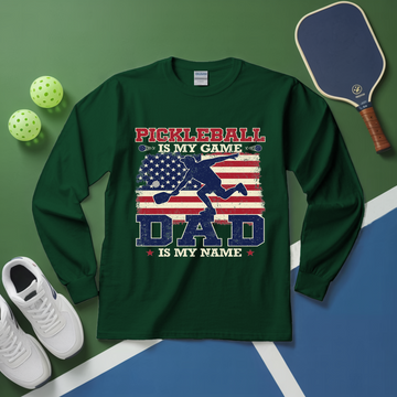 Green long-sleeve shirt with pickleball design on a green and blue background