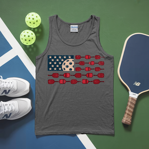 Gray tank top with pickleball design on a green and blue surface with pickleballs and paddle.