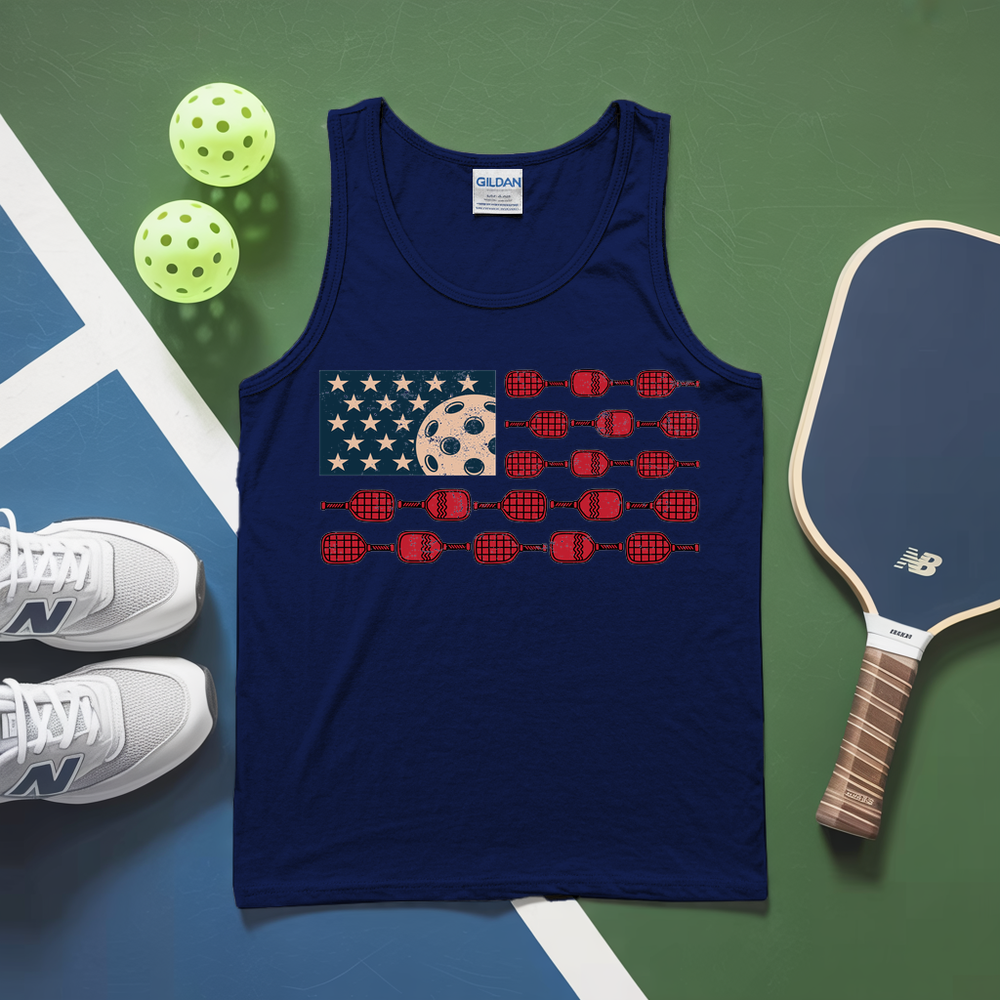 Navy tank top with pickleball design on a green and blue background with pickleballs and paddle.