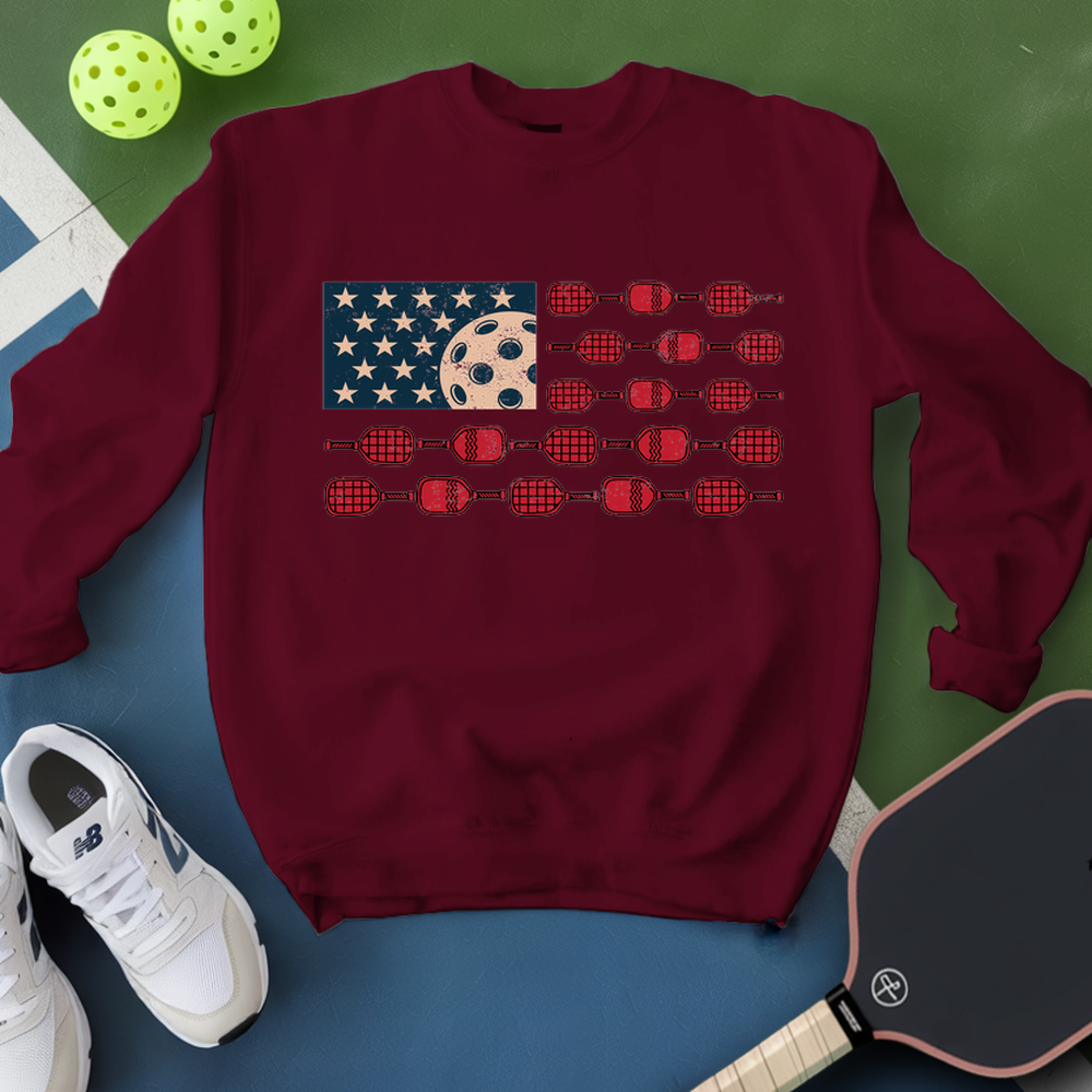 Maroon sweatshirt with American flag design on a green and blue background