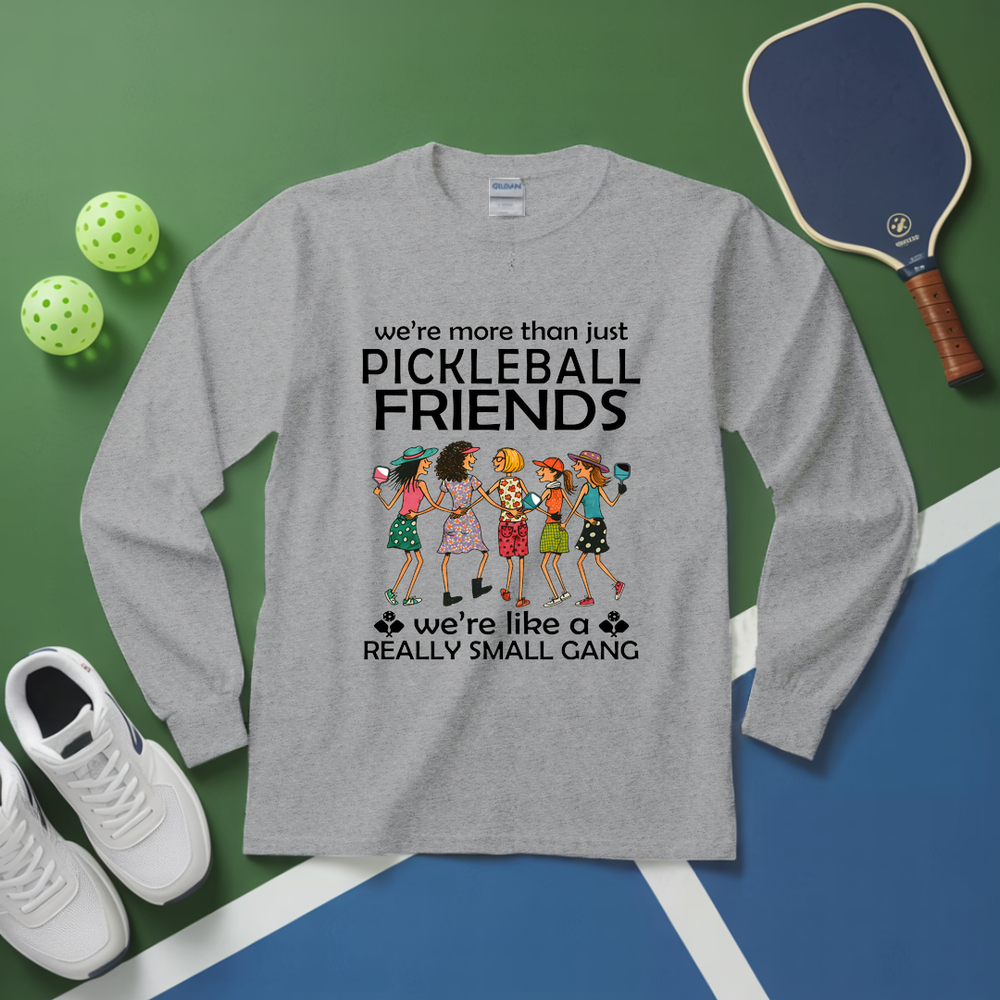 Gray long-sleeve shirt with pickleball-themed design on a green and blue background with pickleballs and a paddle.