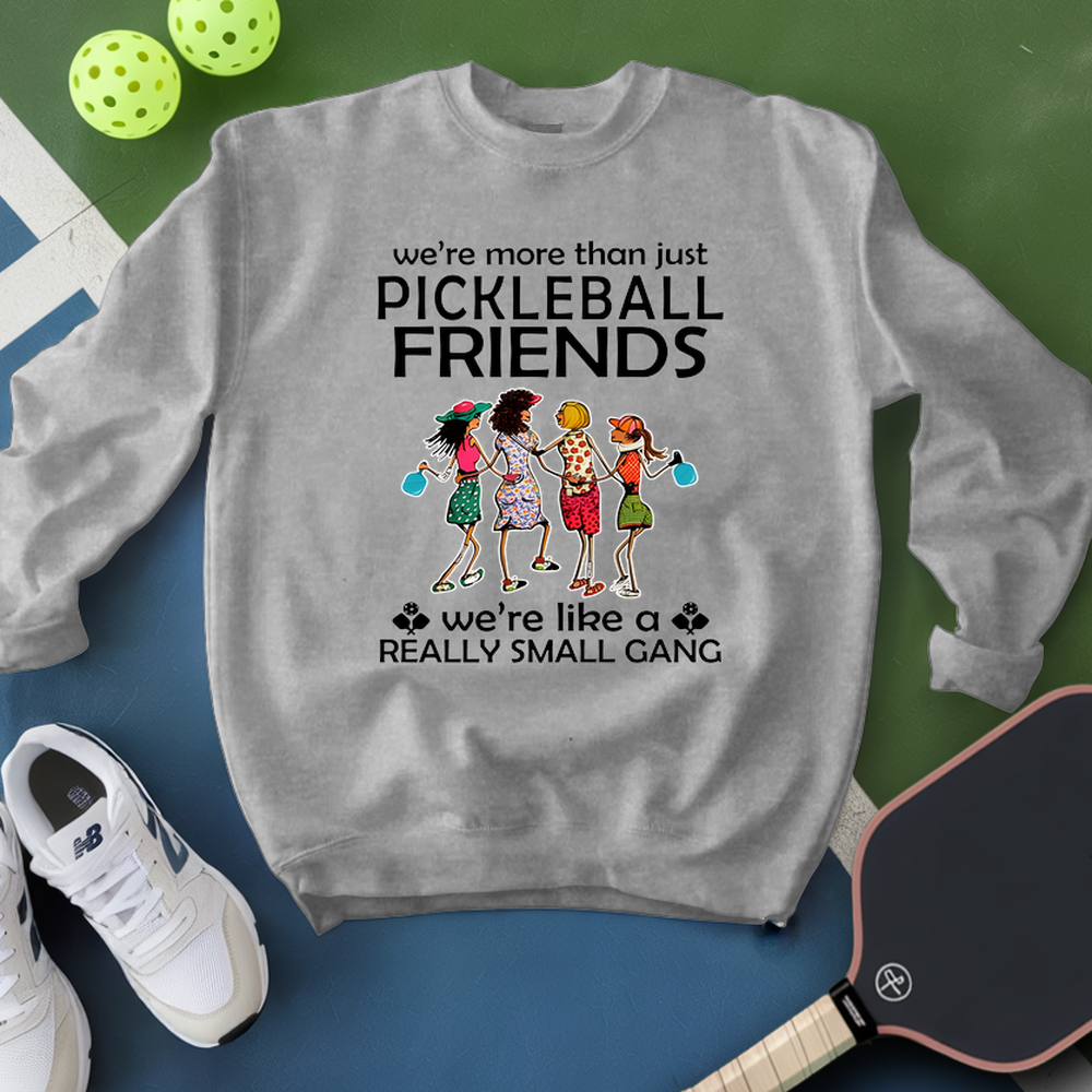 Gray sweatshirt with pickleball-themed design on a green and blue background