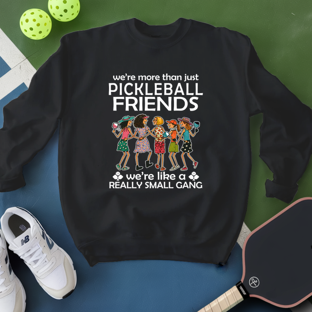 Black sweatshirt with pickleball-themed design on a blue and green background