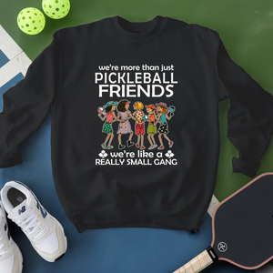 Black sweatshirt with pickleball-themed design on a blue and green background