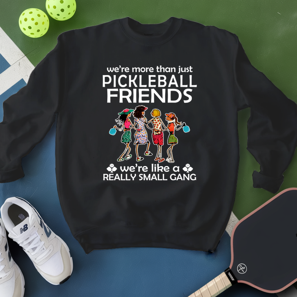 Black sweatshirt with pickleball-themed design on a blue and green background