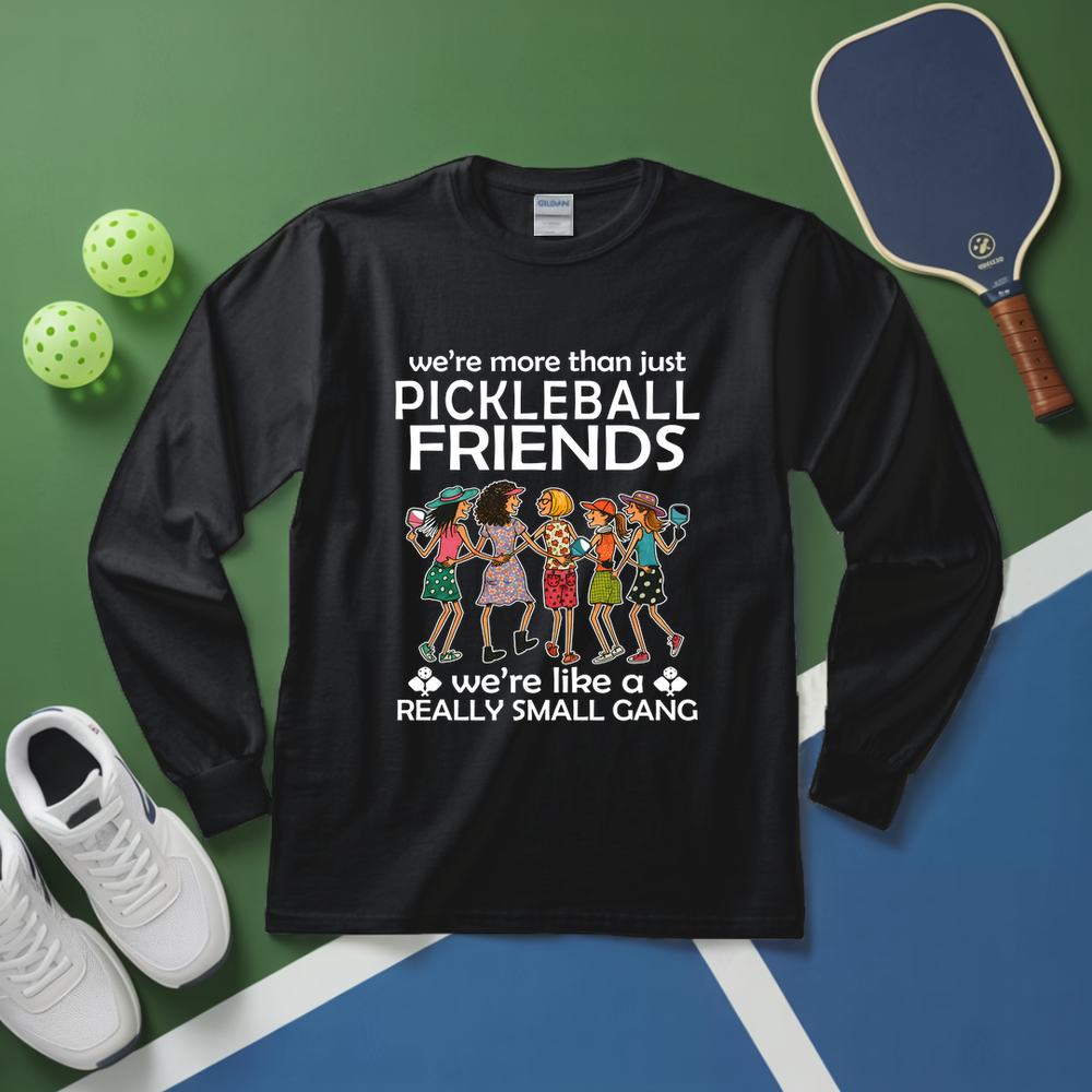 Black long-sleeve shirt with pickleball-themed design on a green and blue background with pickleballs and a paddle.