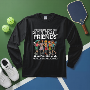 Black long-sleeve shirt with pickleball-themed design on a green and blue background with pickleballs and a paddle.