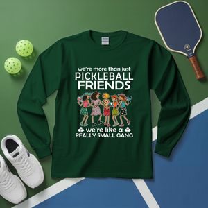 Green long-sleeve shirt with pickleball-themed design on a green and blue background with pickleballs and a paddle.