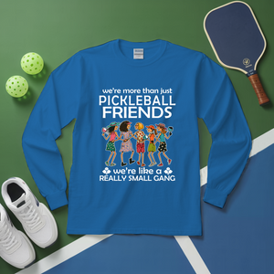 Blue long-sleeve shirt with pickleball-themed design on a green and blue background with pickleballs and a paddle.
