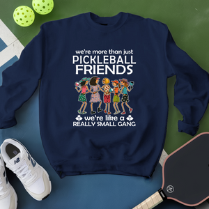 Navy blue sweatshirt with pickleball-themed design on a green and blue background