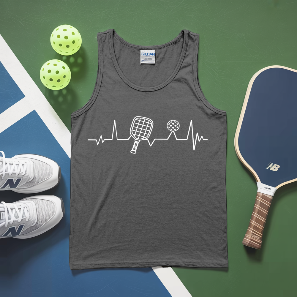 Gray tank top with pickleball design on a green and blue surface with pickleballs and a paddle.