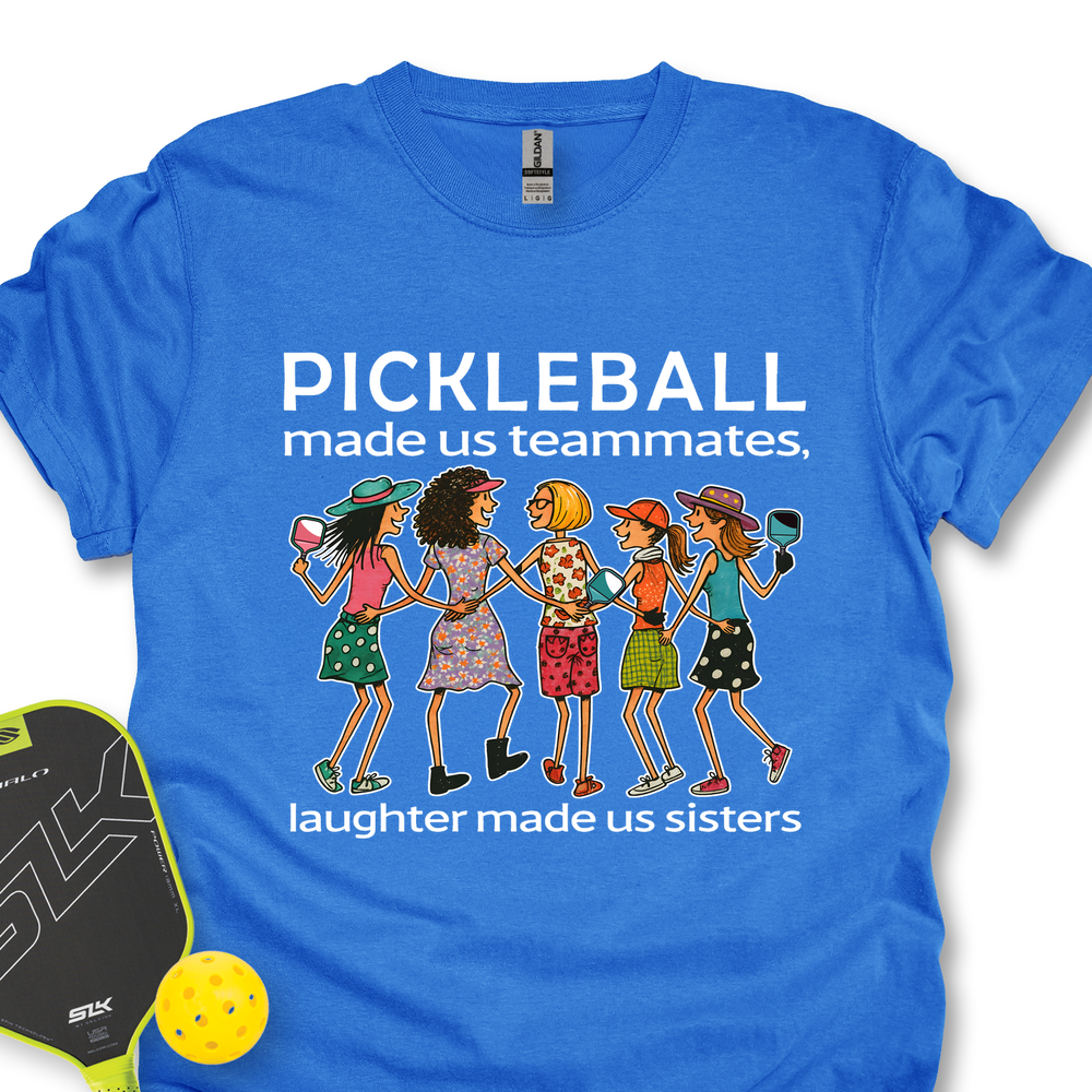 Blue t-shirt with pickleball-themed design and accessories on a white background