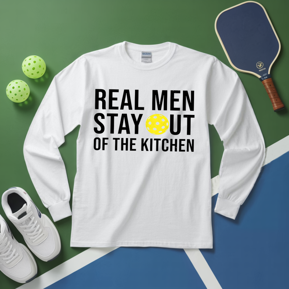 White long-sleeve shirt with text, pickleball equipment on a green and blue background