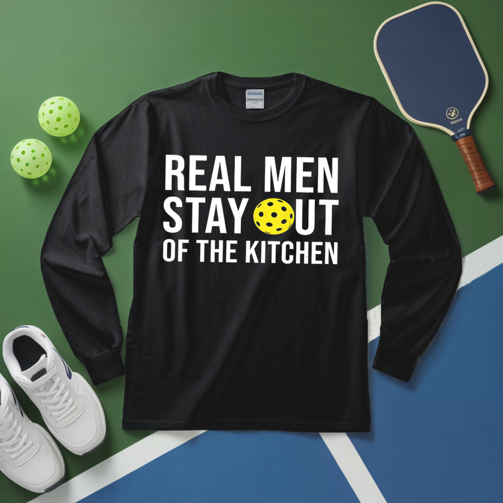 Black long-sleeve shirt with 'Real Men Stay Out of the Kitchen' text on a sports court background.