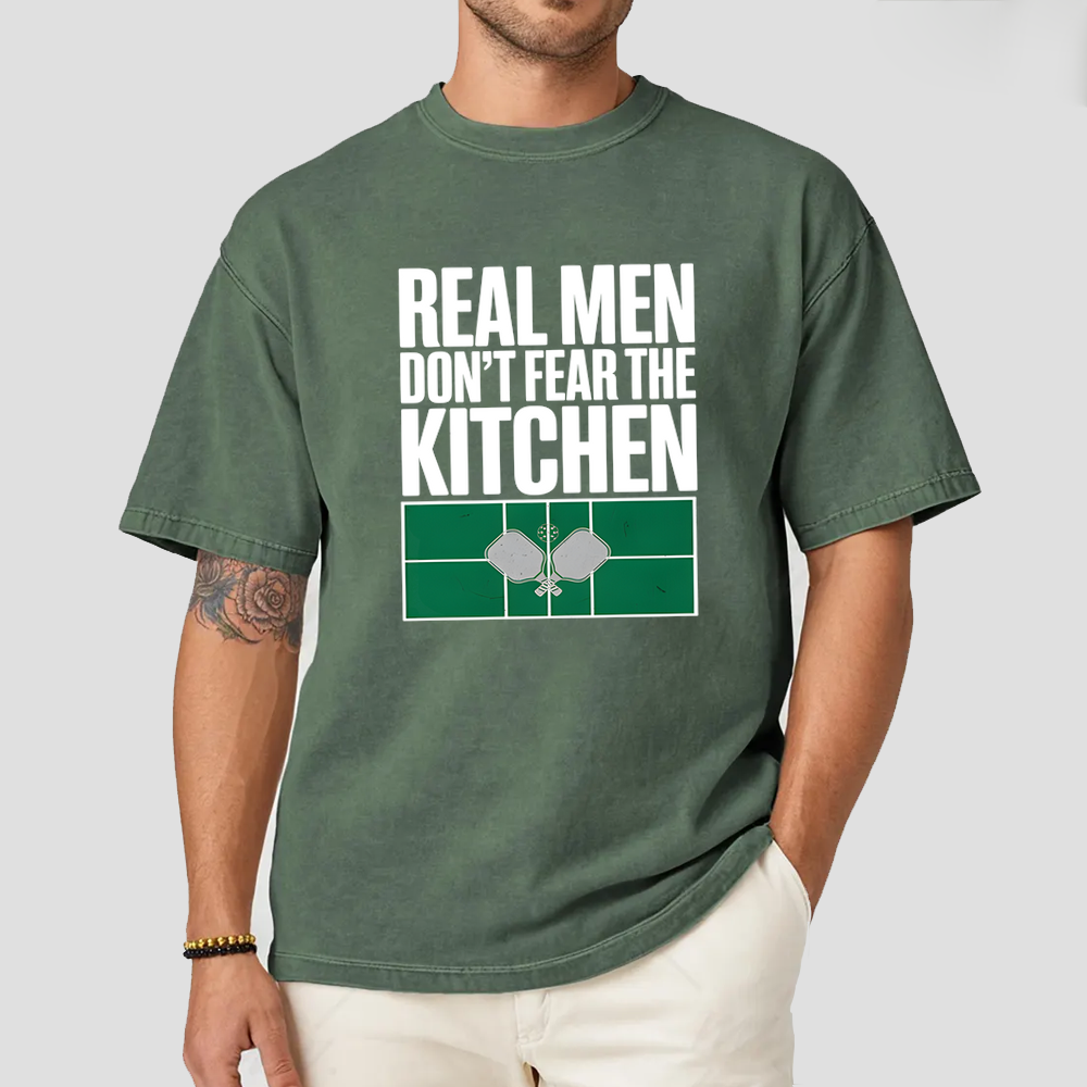 Person wearing a green t-shirt with text and graphic design on a white background