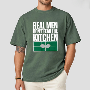 Person wearing a green t-shirt with text and graphic design on a white background