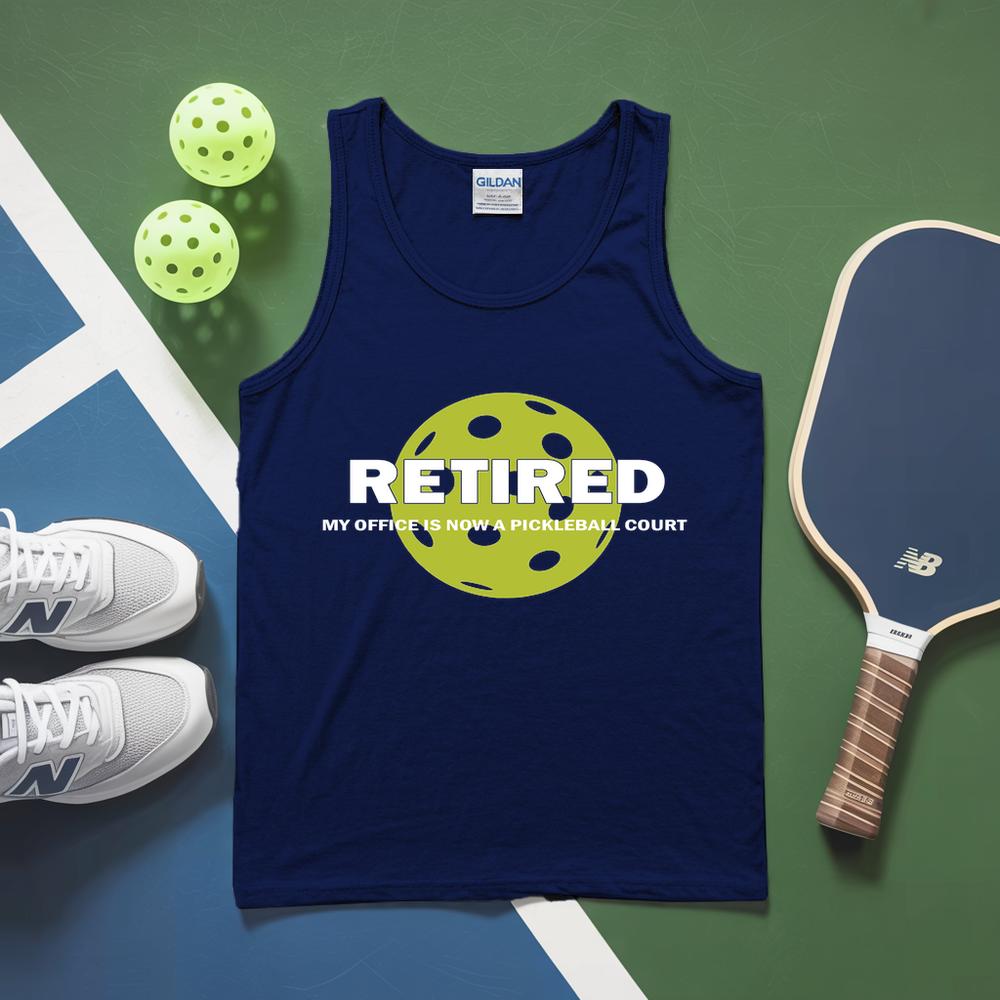 Blue tank top with pickleball design and text, placed on a pickleball court with balls and paddle.