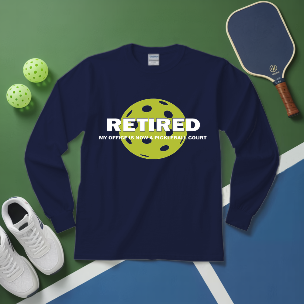 Navy blue sweatshirt with pickleball design and text on a green and blue background with pickleball equipment.