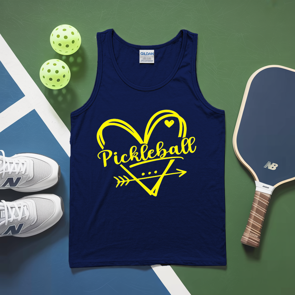 Navy tank top with yellow 'Pickleball' design on a green and blue surface with pickleballs and a paddle.