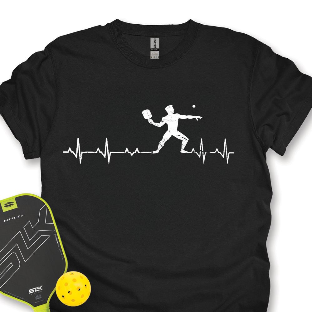 Black t-shirt with pickleball player design and paddle and ball on a white background