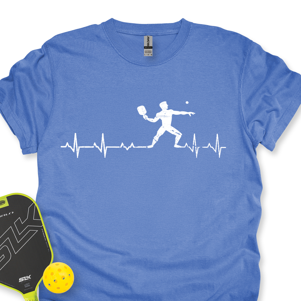 Blue t-shirt with pickleball design and paddle and ball on a white background