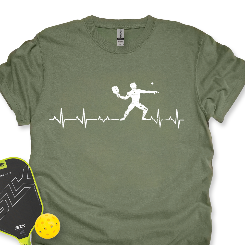Green t-shirt with pickleball design and paddle and ball on a white background
