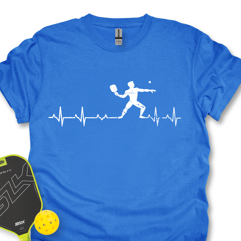 Blue t-shirt with pickleball design and paddle and ball on a white background