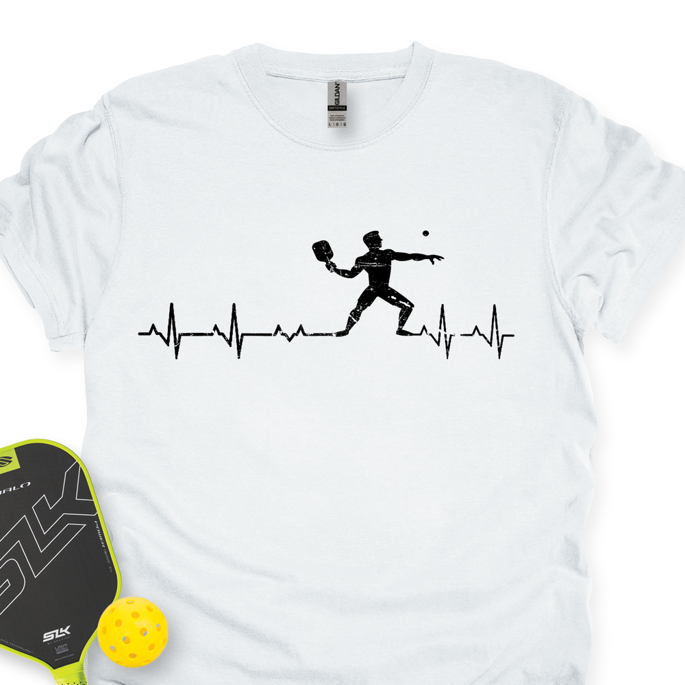White t-shirt with pickleball design and paddle and ball on a white background