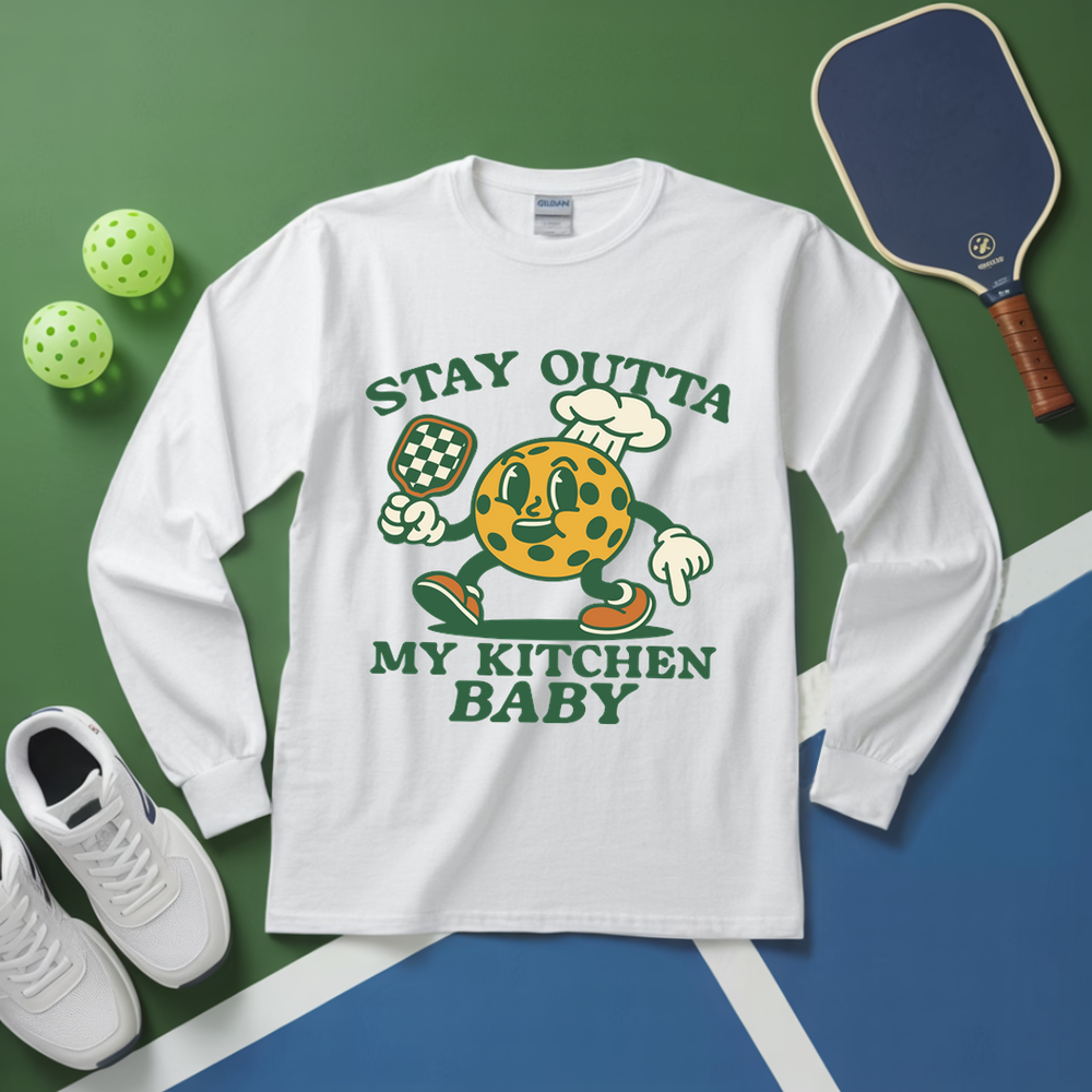 White long-sleeve shirt with a cartoon character graphic and text on a green and blue background.