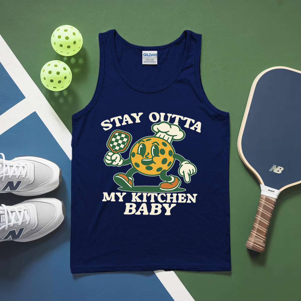 Blue tank top with cartoon character and text on a green and blue background with pickleball equipment.