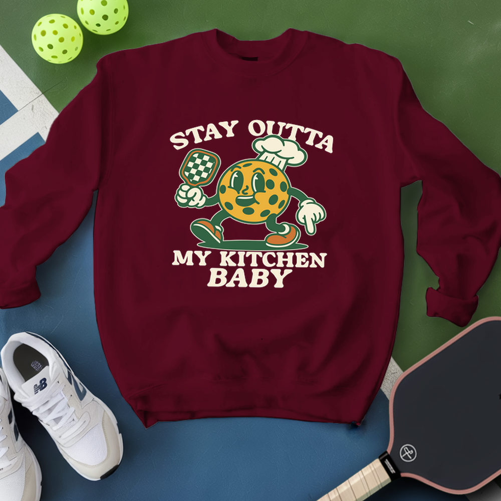 Maroon sweatshirt with graphic design and text on a green and blue background